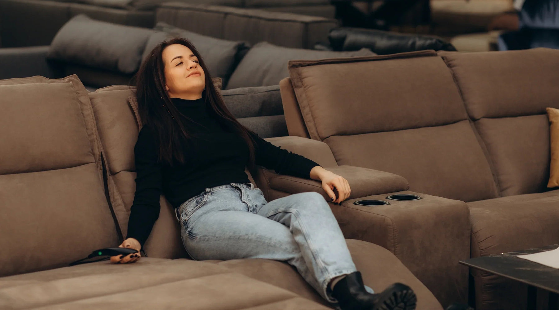Comfortable reclining sectional sofa in a modern living room showing various seating configurations
